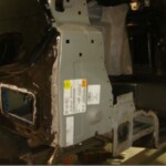 Before and after photographs of a damaged black Volkswagon Jetta that was repaired by Elite Paint & Body Shop in West Palm Beach, Florida.